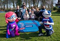 Local families with Rochdale's Healthy Heroes Rochelle and Hercules the Hornet